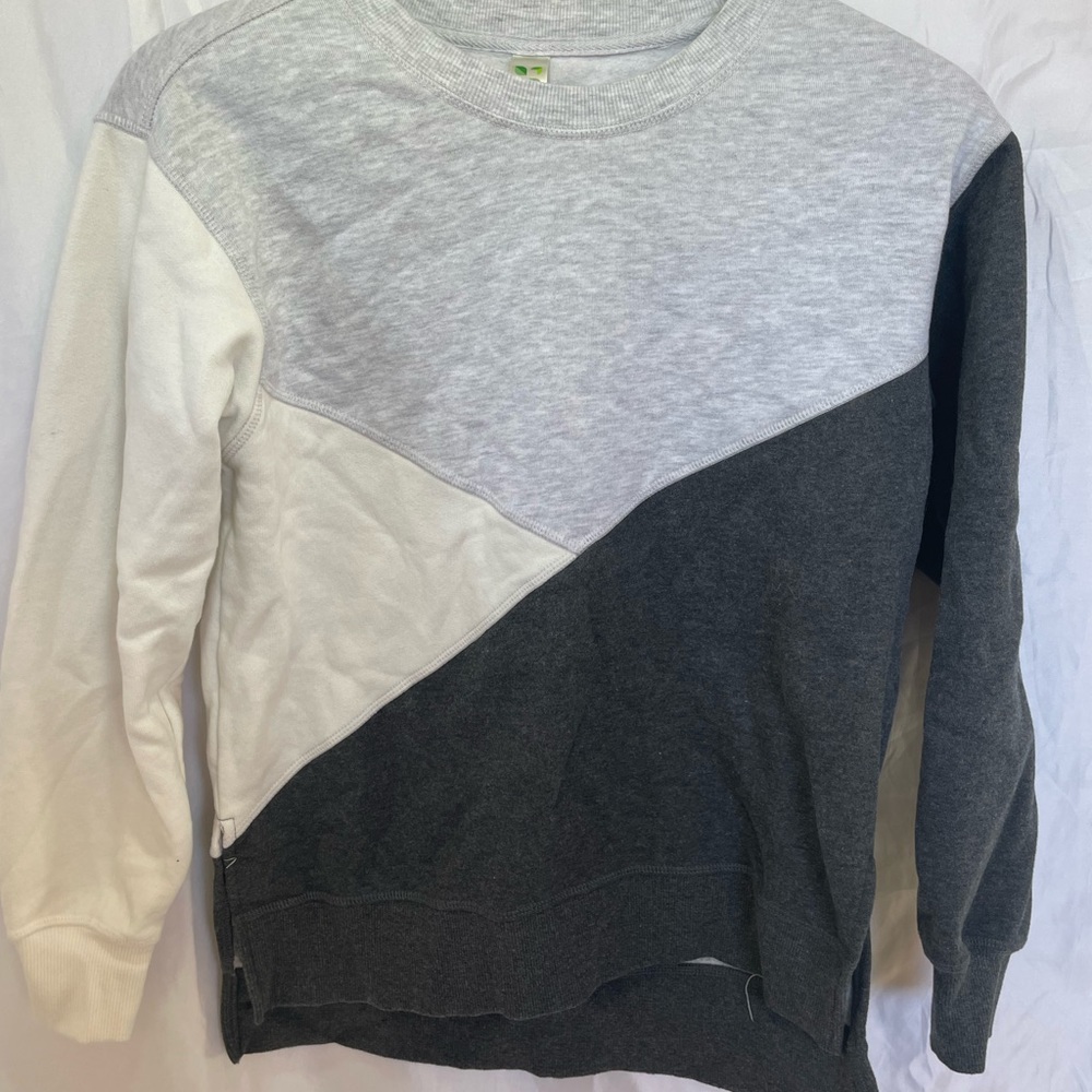 Neutral colored sweater.